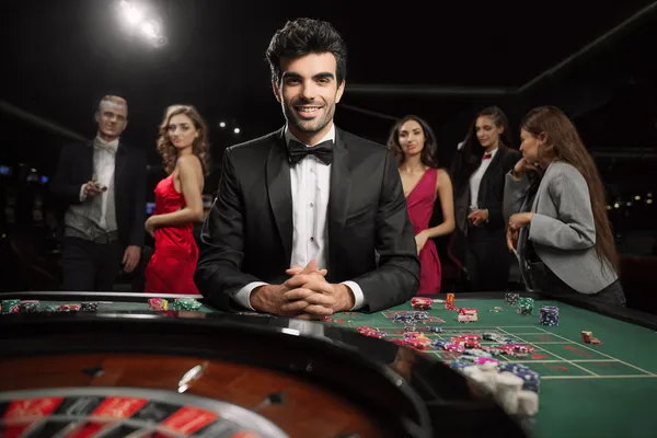 A glamorous woman holding casino chips in a neon-lit environment, representing the premium online casino atmosphere of JLWAFA.