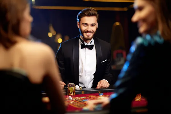 A glowing roulette wheel with cascading chips, symbolizing the engaging live and instant-win games available on JLWAFA.